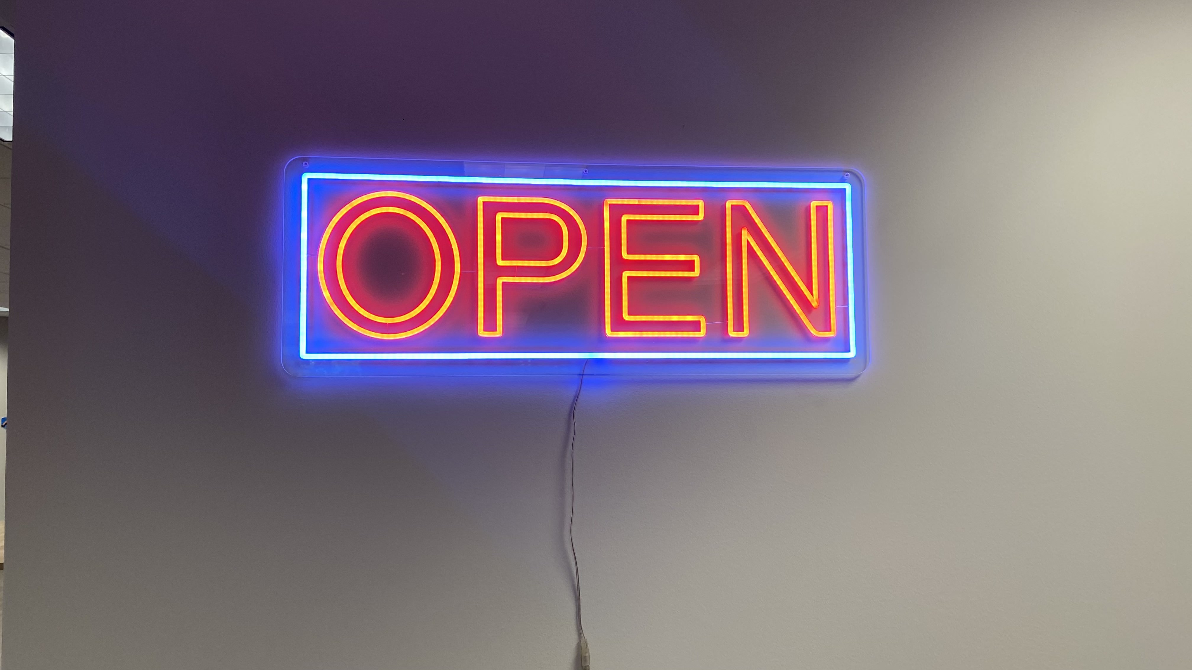 The Impact of Open Neon Signs: Attracting Customers and Creating an Inviting Atmosphere 